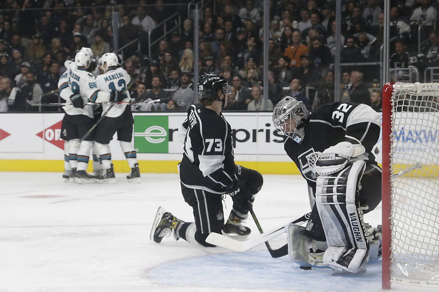 Kings goalie Jonathan Quick and forward Tyler Toffoli hang their heads after allowing a third period goal to Sharks forward Joonas Donskoi on April 22.