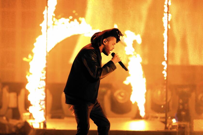 The Weeknd (Abel Tesfaye), seen performing at the American Music Awards in November, seems even more twisted on "Beauty Behind the Madness."