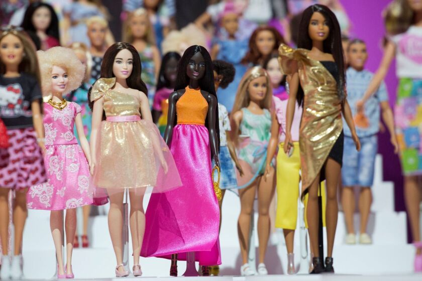 FILE- In this Feb. 20, 2018, file photo dozens of Barbie dolls are displayed at the Mattel showroom at Toy Fair in New York. Mattel reports earnings Thursday, April 26. (AP Photo/Mark Lennihan, File)