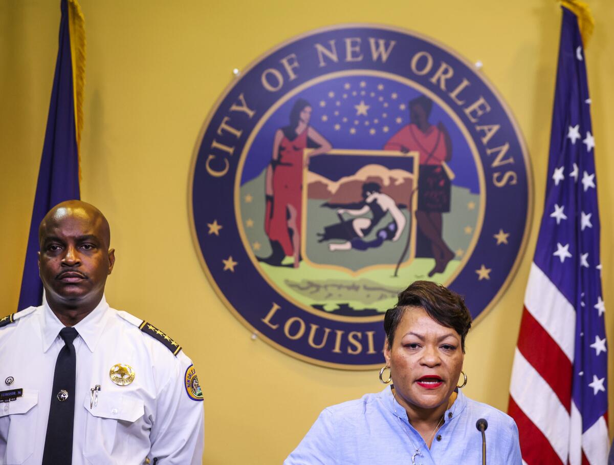 FILE - New Orleans Mayor LaToya Cantrell speaks at a news conference with New Orleans Police Department Superintendent Shaun Ferguson at City Hall in New Orleans, Thursday, Aug. 4, 2022. On Tuesday, Aug. 16, 2022, New Orleans officials asked a federal judge to end court-supervised oversight of its police department under a pact negotiated with the U.S. Justice Department a decade earlier, after deadly police shootings of civilians following Hurricane Katrina cast renewed scrutiny on the scandal-plagued department. (Sophia Germer/The Times-Picayune/The New Orleans Advocate via AP, File)
