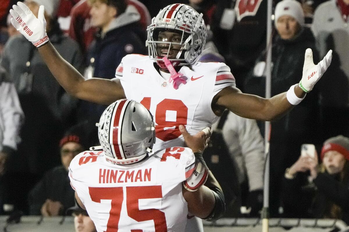 Ohio State's Marvin Harrison Jr. is congratulated.