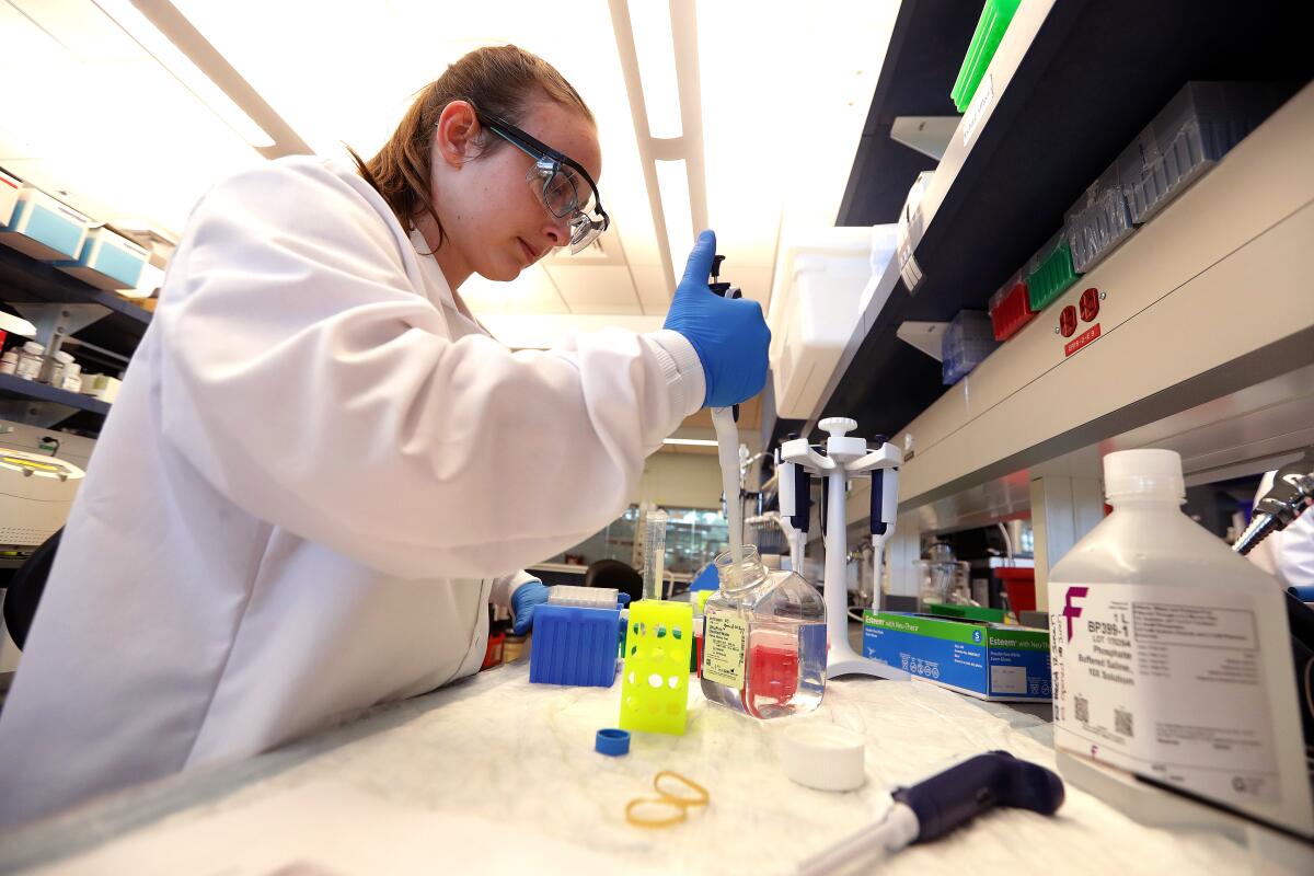 Kasey Jackson, a postdoctoral fellow, preps samples for analysis at Sanofi Genzyme in Framingham, Mass., in June 2017.