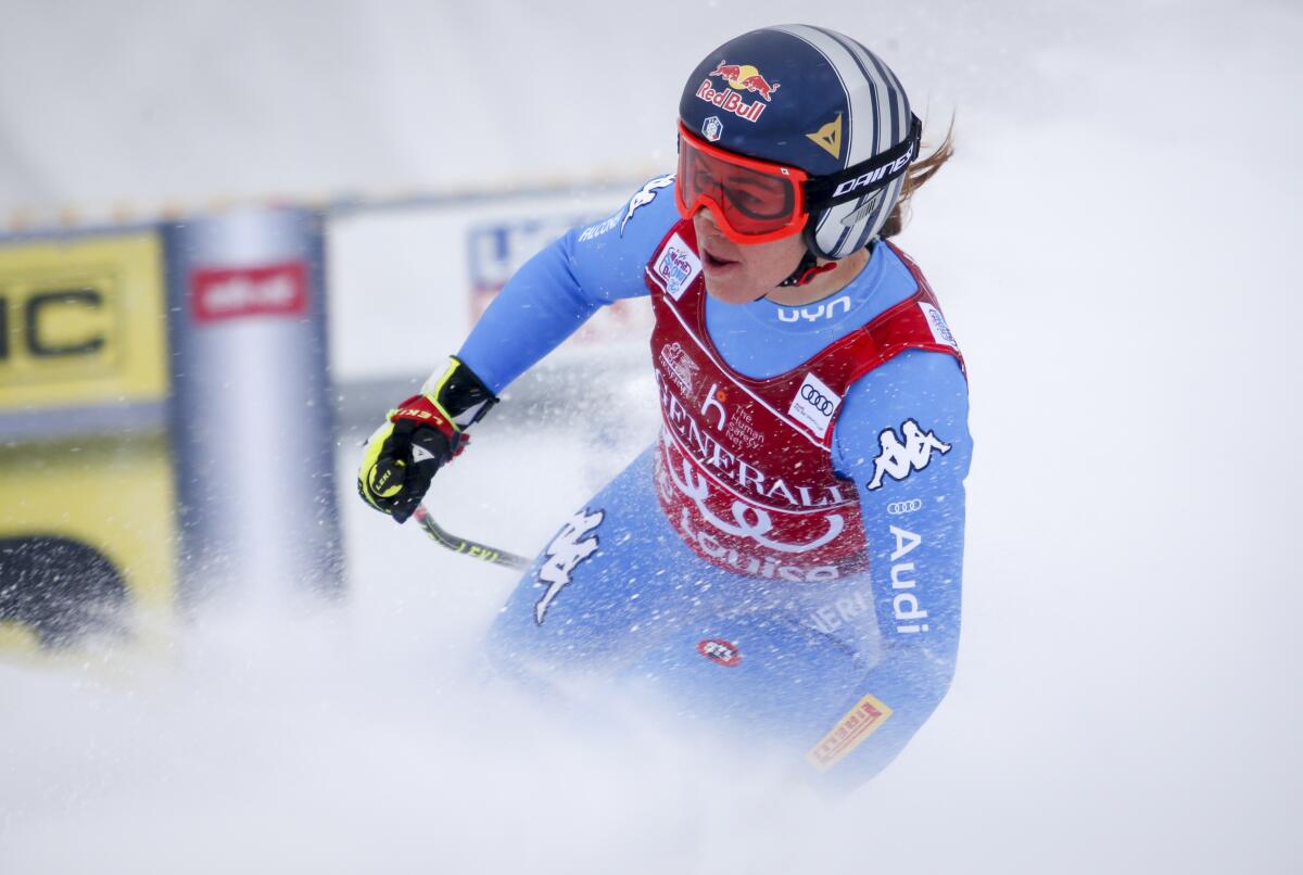 Italy's Sofia Goggia reacts in the finish area following her run in the the women's World Cup downhill ski race in Lake Louise, Alberta, on Saturday, Dec. 4, 2021. (Jeff McIntosh/The Canadian Press via AP)