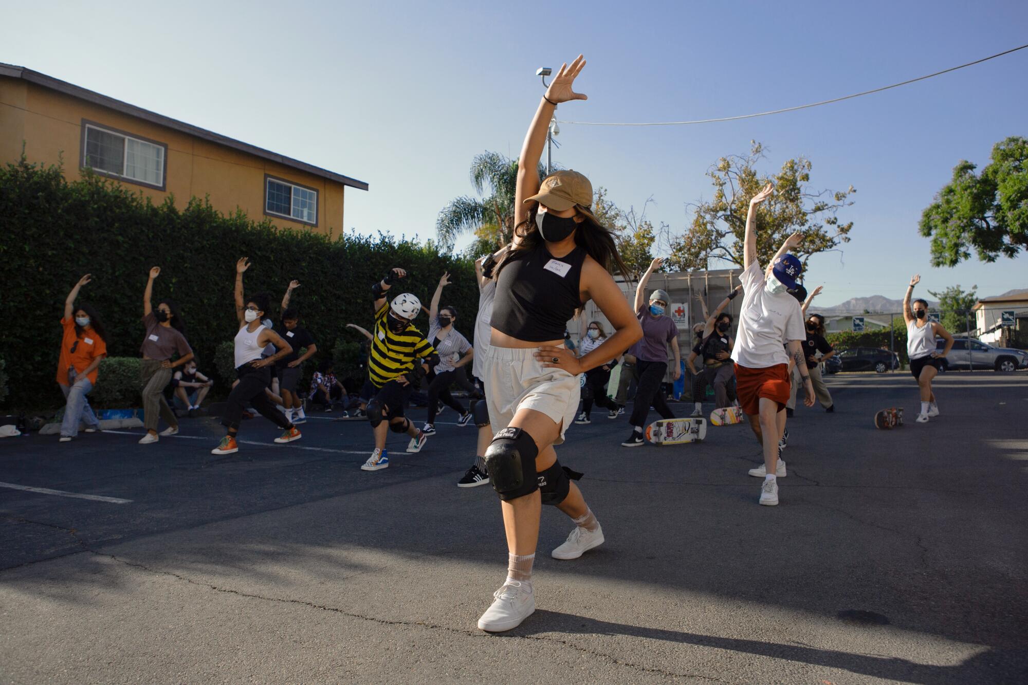 Boos Cruise members stretch before they practice skating on Sunday, Aug. 29, 2021, in Los Angeles, CA.