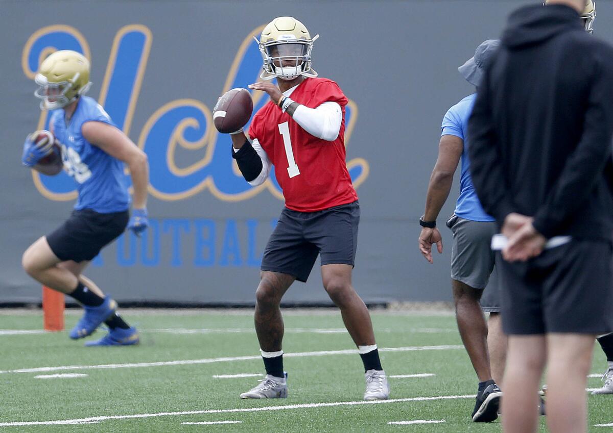 UCLA quarterback Dorian Thompson-Robinson throws in practice on July 31.