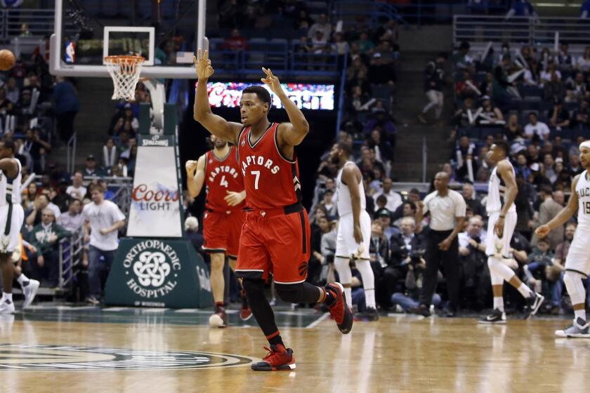 Raptors guard Kyle Lowry (7) reacts after making a three-point basket against the Bucks during the second half.