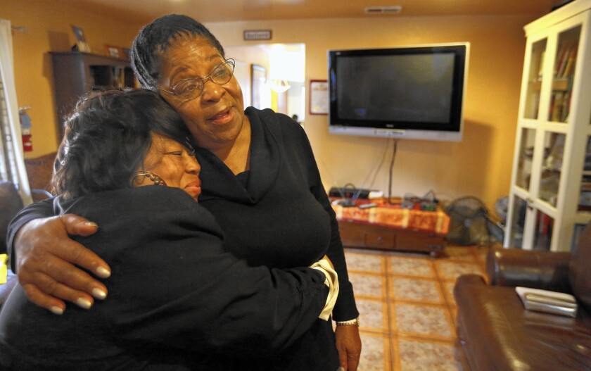 Susan Burton, right, hugs Georgia Horton, a resident of Burton's reentry program for women recently released from prison.