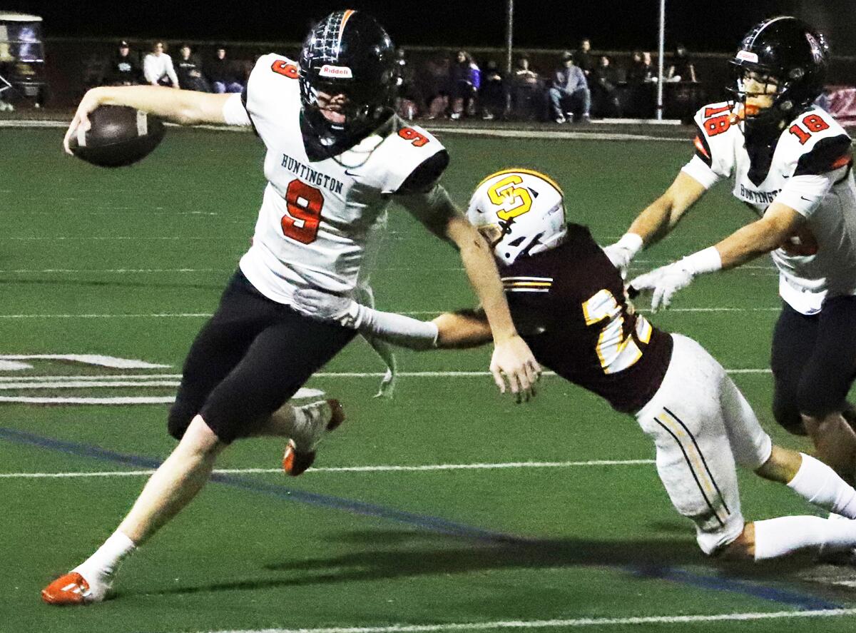 Huntington Beach quarterback Brady Edmunds (9) runs for a first down in a CIF Southern Section Division 6 semifinal Friday.