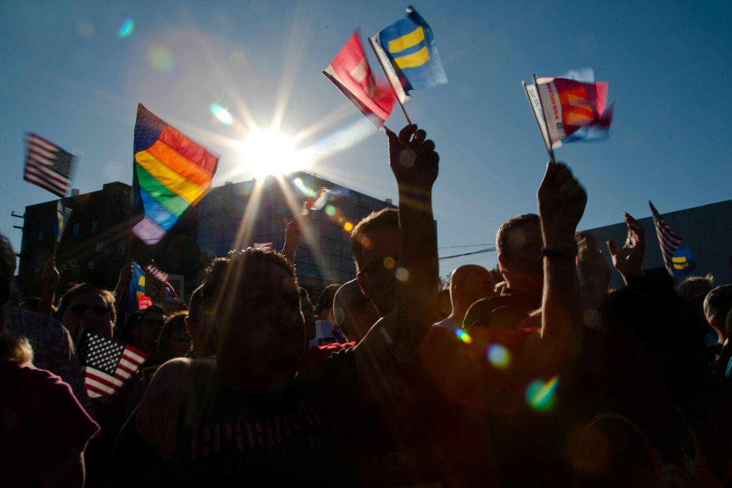 Rainbow flags and flags of equality are raised in West Hollywood.