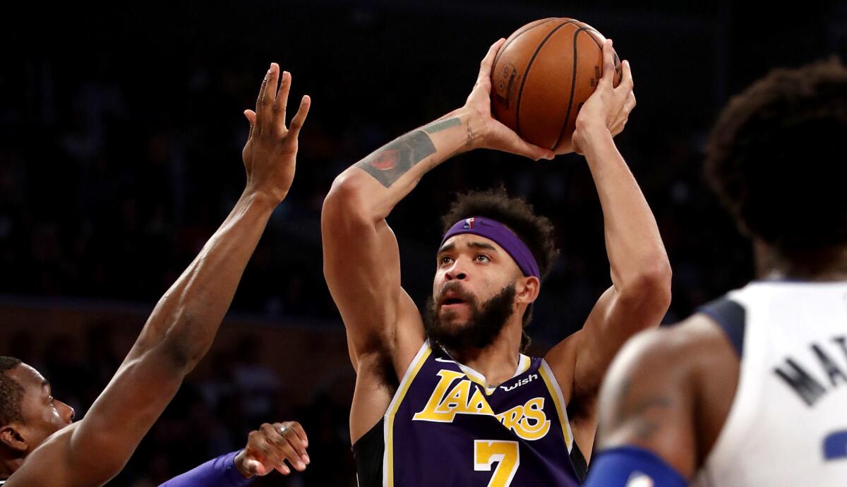 Lakers center Javale McGee goes to the basket against the Mavericks during the second quarter Wednesday.