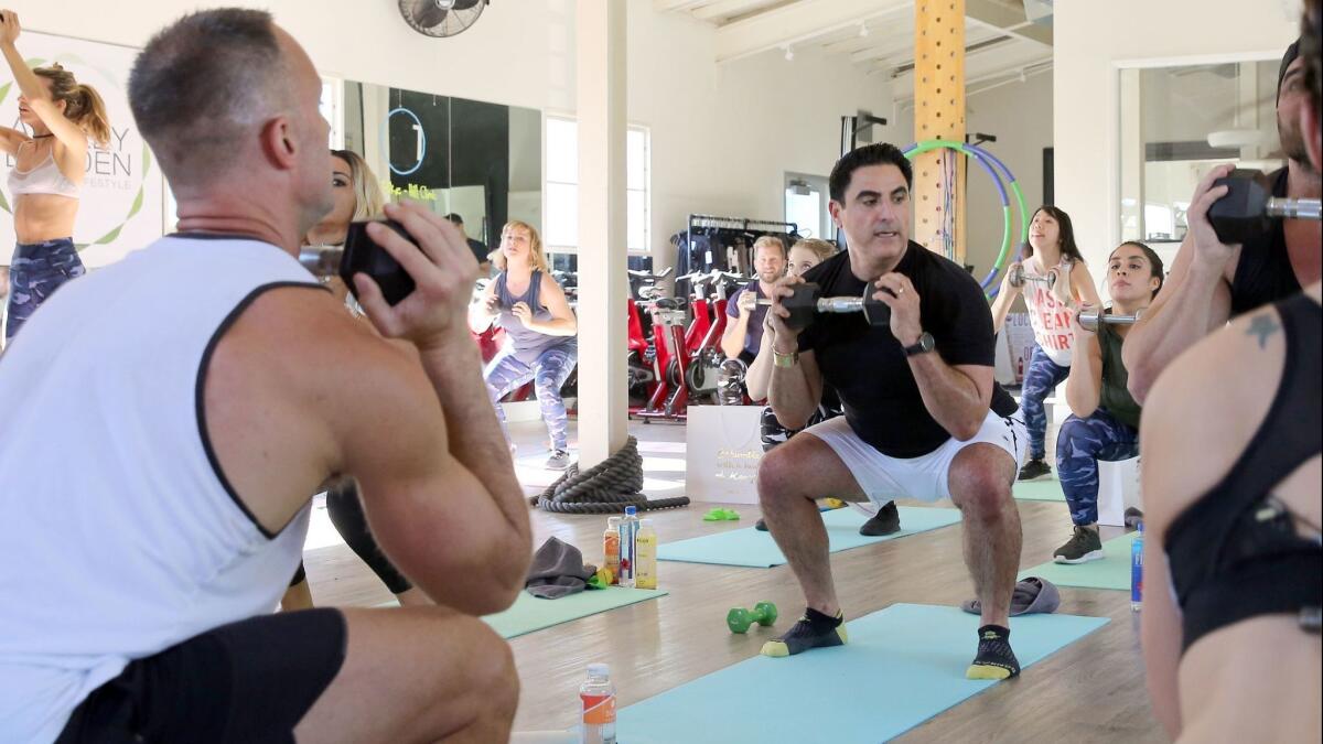 Reza Farahan works out with the class.