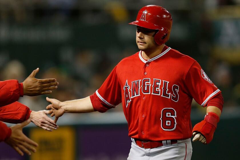 OAKLAND, CA - MARCH 30: David Fletcher #6 of the Los Angeles Angels of Anaheim celebrates with teammates after scoring on a sacrifice fly ball off the bat of Mike Trout in the top of the eighth inning against the Oakland Athletics at Oakland-Alameda County Coliseum on March 30, 2019 in Oakland, California. (Photo by Lachlan Cunningham/Getty Images) ** OUTS - ELSENT, FPG, CM - OUTS * NM, PH, VA if sourced by CT, LA or MoD **