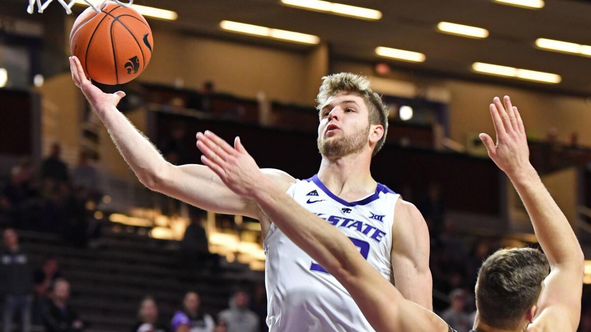 Dean Wade of the Kansas State Wildcats drives in for a basket against the Lehigh Mountain Hawks.