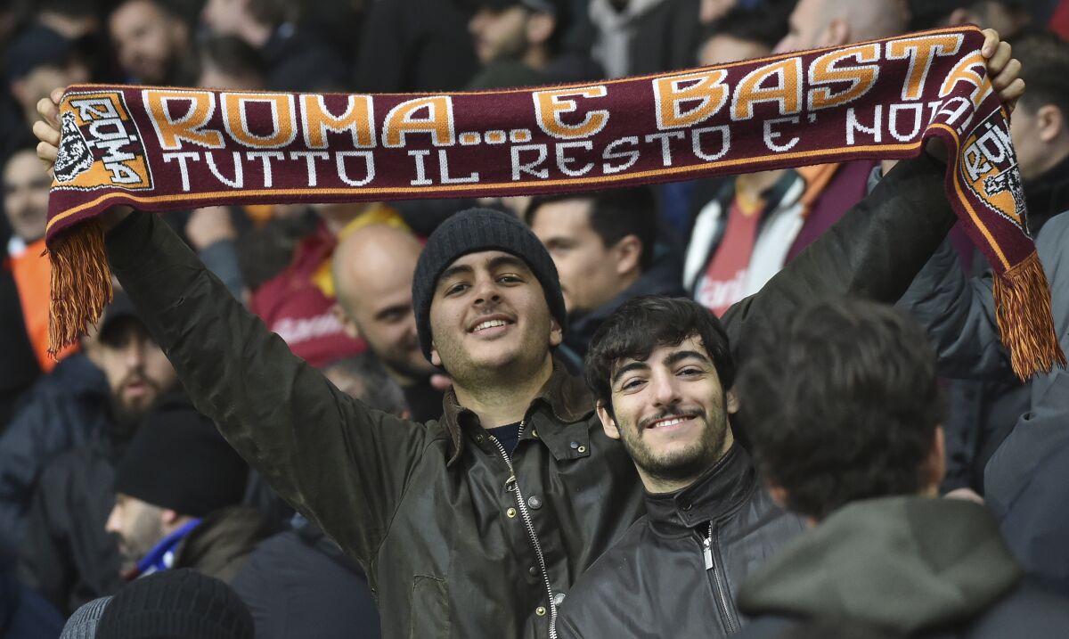 Roma fans cheer for their team ahead the Europa Conference League semi final match between Leicester City and Roma at the King Power Stadium in Leicester, England, Thursday, April 28, 2022. (AP Photo/Rui Vieira)