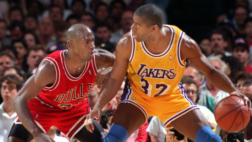 The Lakers' Magic Johnson tries to move past Michael Jordan of the Chicago Bulls during the 1991 NBA Finals as the Showtime era faded in Los Angeles.
