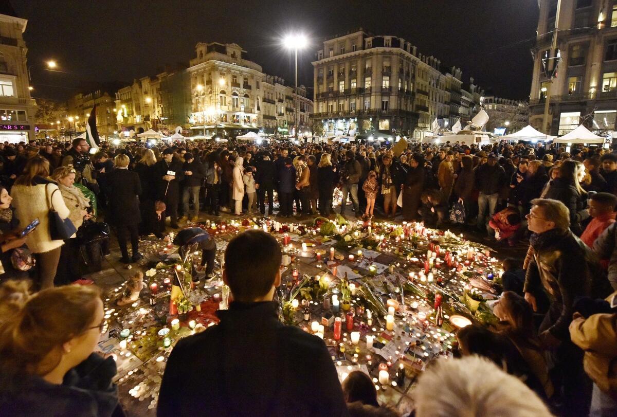 Hundreds of people come together at Place de la Bourse in Brussels on Wednesday to mourn the attacks that occurred the previous day.