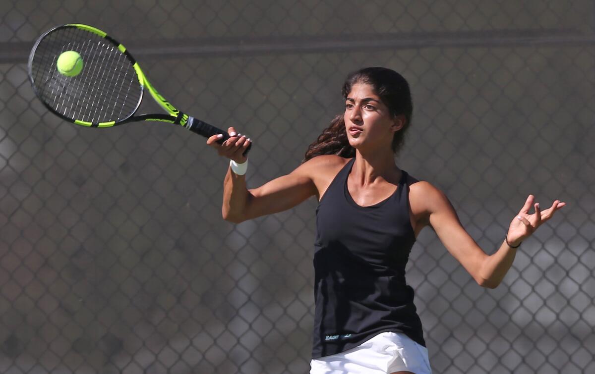 Sage Hill's Karina Grover hits a forehand during her singles set against Santa Margarita in a nonleague match in Newport Beach on Wednesday.