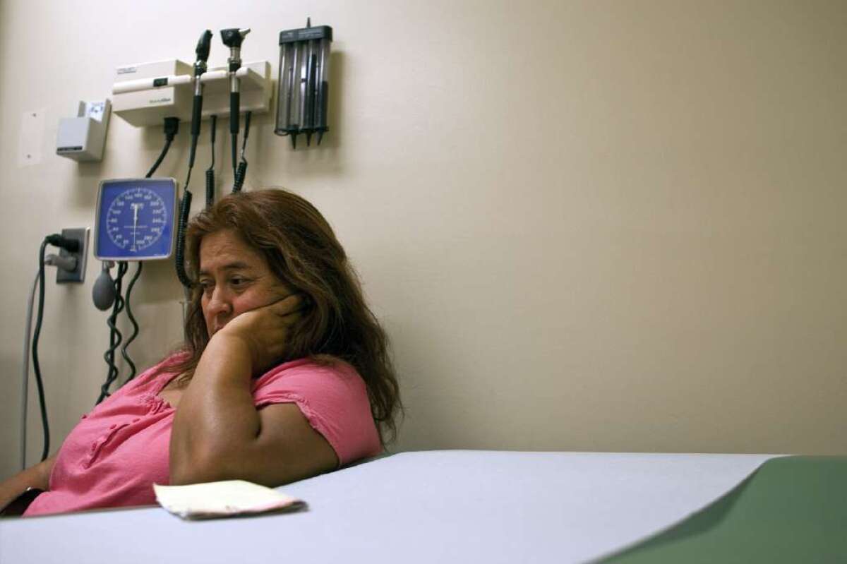 About 1 in 13 Americans suffers from moderate or severe depression, with women disproportionately affected, a new study says. Above, Teresa Hernandez, waits to see a doctor about her anxiety and depression issues at the El Monte Comprehensive Health Center.