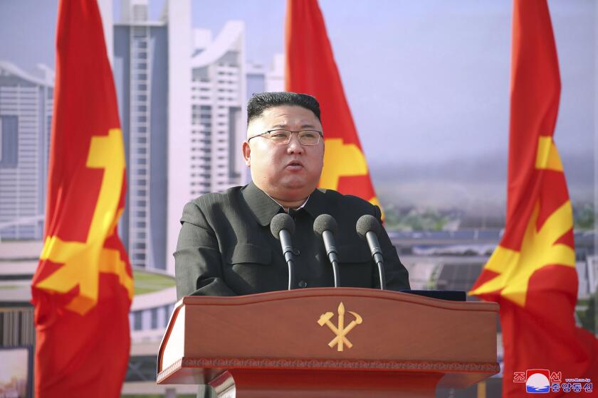In this photo provided by the North Korean government, North Korean leader Kim Jong Un speaks during a ceremony to break ground for building 10,000 homes, in Pyongyang, North Korea, Tuesday, March 23, 2021. The White House says North Korea fired short-range missiles this past weekend, just days after his sister Kim Yo Jong threatened the United States and South Korea for holding joint military exercises. Independent journalists were not given access to cover the event depicted in this image distributed by the North Korean government. The content of this image is as provided and cannot be independently verified. Korean language watermark on image as provided by source reads: "KCNA" which is the abbreviation for Korean Central News Agency. (Korean Central News Agency/Korea News Service via AP)