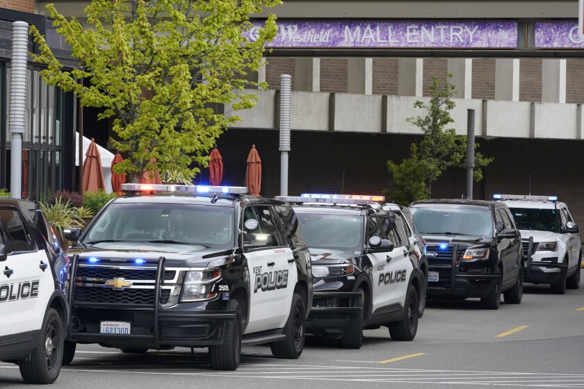 Police vehicles respond to a reported shooting, Saturday, May 1, 2021, at Southcenter Mall in Tukwila, Wash., south of Seattle. (AP Photo/Ted S. Warren)