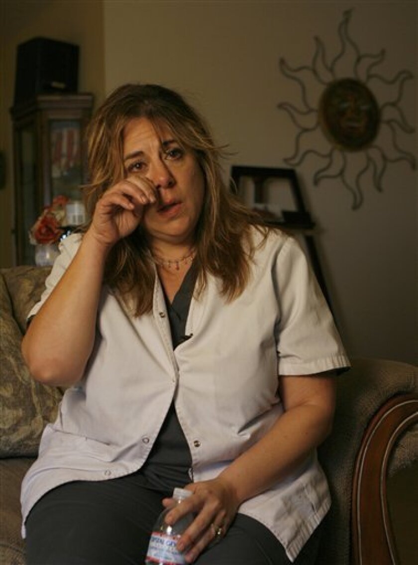 Roxanne Jauregui, a close friend of Sylvia Pardo, comments on Bruce Padro's character, during an interview at her home in Pomona, Calif. on Tuesday, Dec. 30, 2008. Sylvia Pardo and eight of her immediate family members died late Christmas Eve when Pardo's ex-husband, Bruce, donned a Santa Claus suit, burst into a holiday party on a shooting rampage and then torched his former in-laws' home. (AP Photo/Damian Dovarganes)
