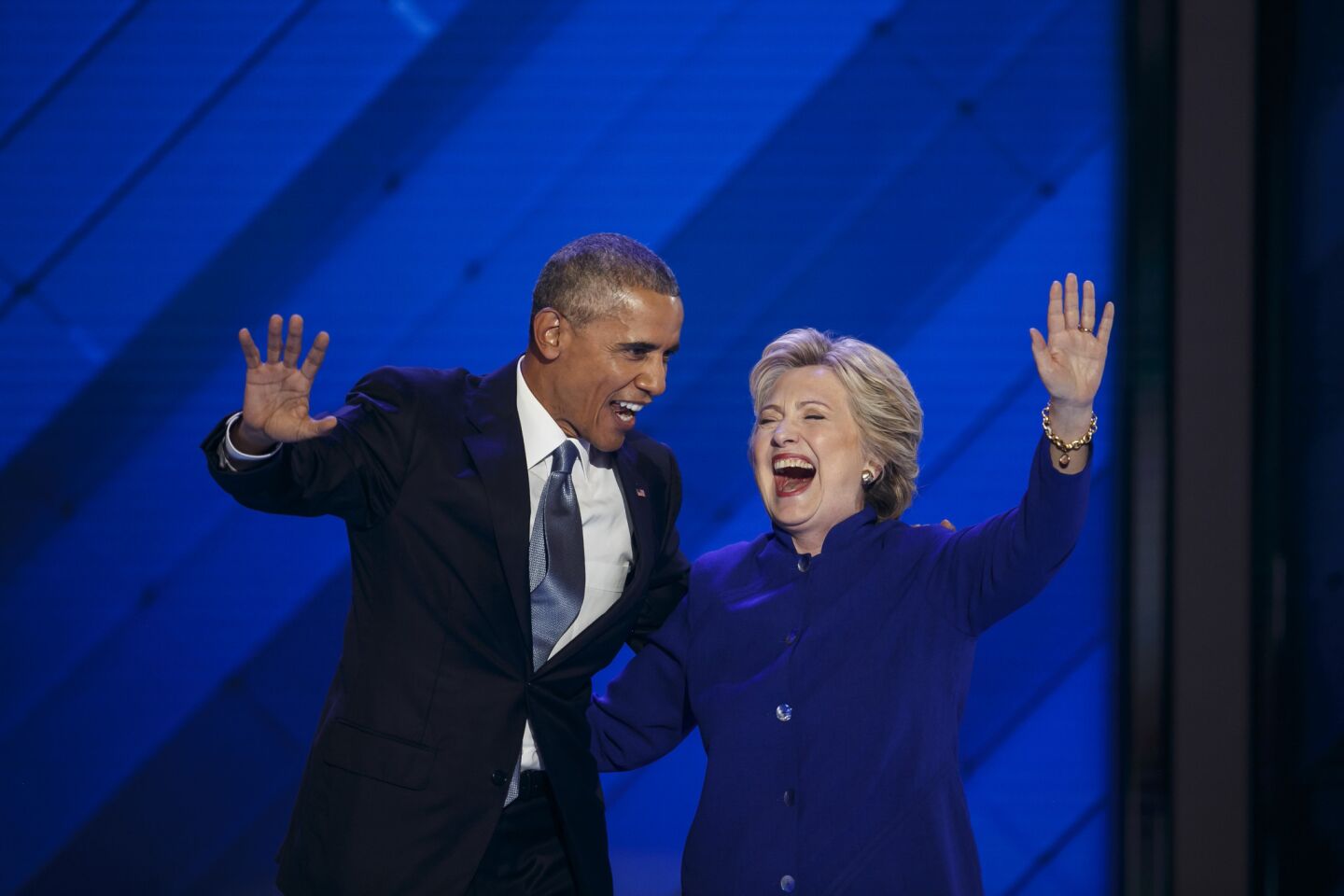 President Barack Obama and Democratic nominee for President Hillary Clinton wave at the crowd at the 2016 Democratic National Convention in Philadelphia.