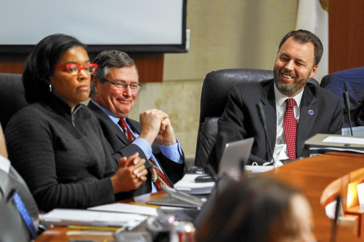 Cal State Chancellor Timothy P. White, center, at a meeting in March. “We're actually very pleased about what we were able to craft,” White said of the deal announced Friday.