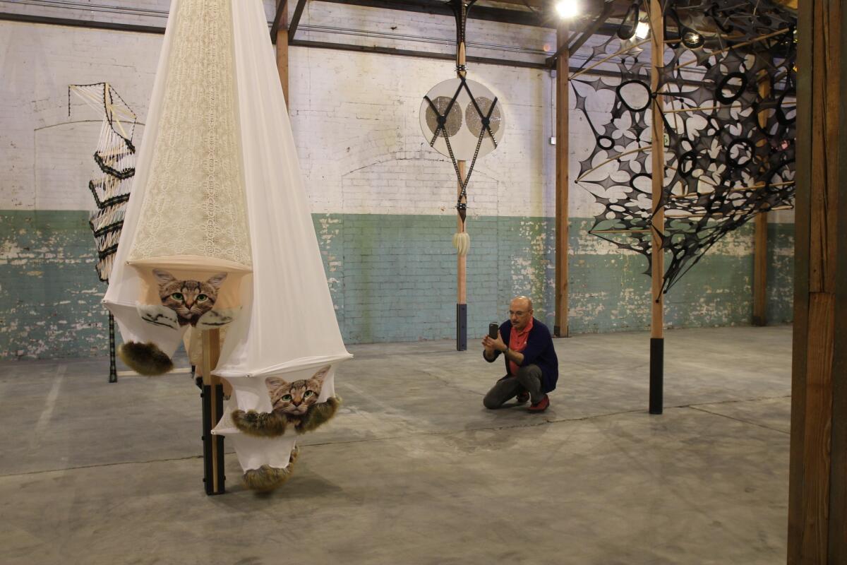 An unfinished warehouse space contained sculptures by contemporary artists, including Dutch-American sculptor Lara Schnitger. In the foreground is "Notorious Five," from 2016.
