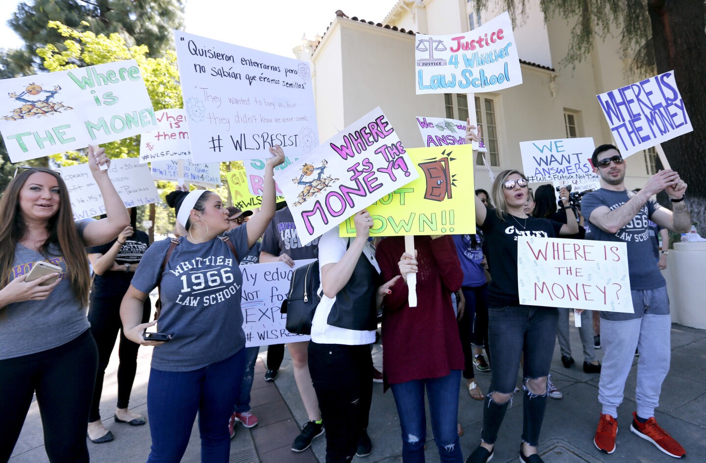 Whittier Law School students protest the closing of the Costa Mesa campus in front of Whittier College in Whittier, on Friday, April 21, 2017. The college's board of trustees recently decided to halt enrollment and close the law school in Costa Mesa.