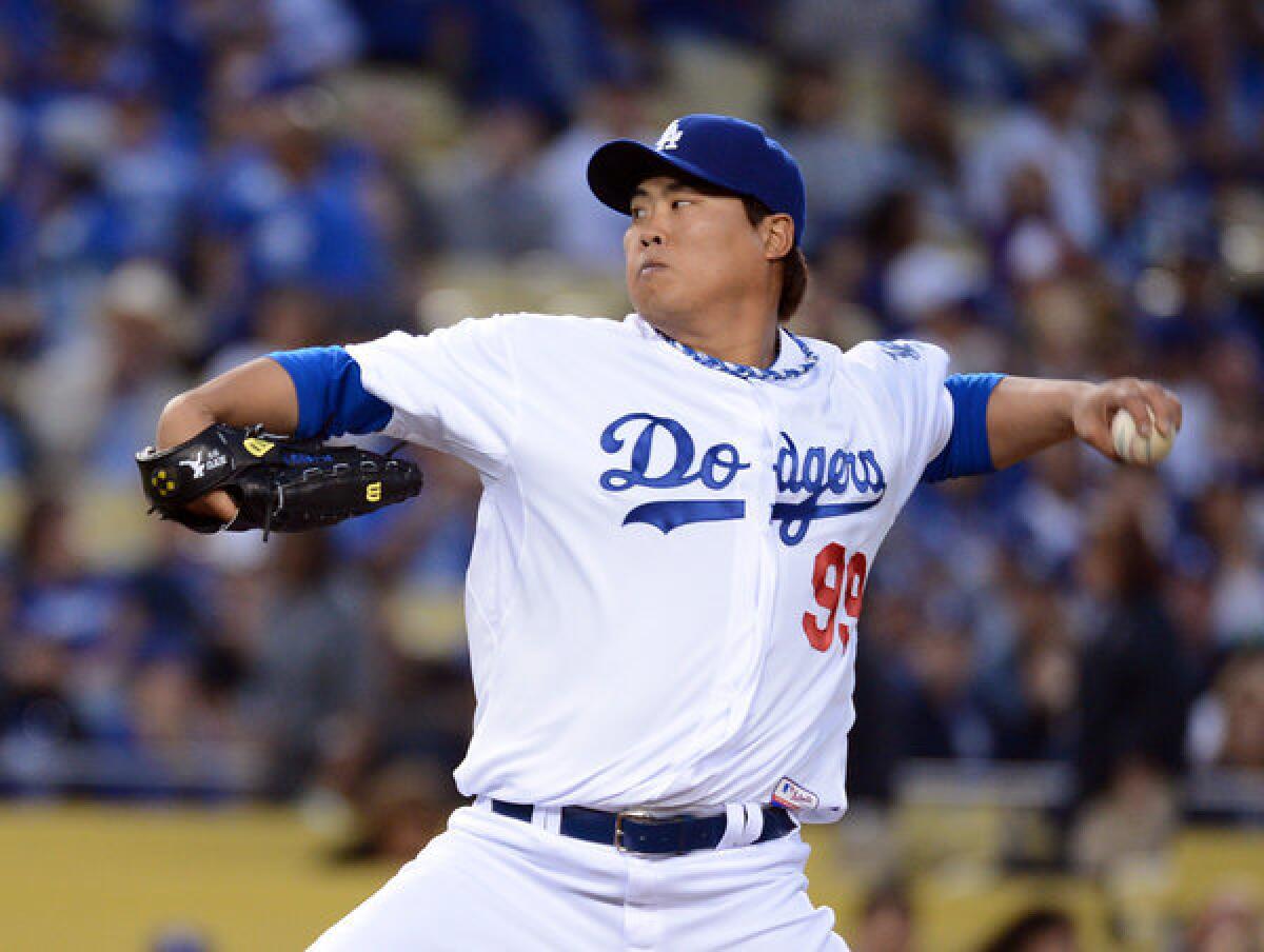 Hyun-jin Ryu of the Los Angeles Dodgers makes his first pitch against the San Francisco Giants at Dodger Stadium.