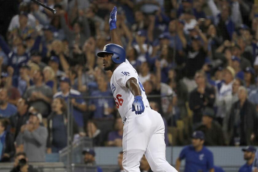LOS ANGELES, CALIF. - SEP. 19, 2018. Dodgers pinch hitter Yasiel Puig strokes a three-run homer against the Rockies in the seventh inning Wednesday, Sept. 19, 2018, at Dodger Stadium in Los Angeles. (Luis Sinco/Los Angeles Times)