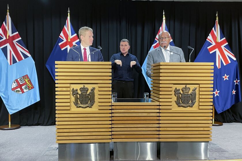 Fiji Prime Minister Sitiveni Rabuka, right, and New Zealand Prime Minister Chris Hipkins answer questions at a media conference in Wellington, New Zealand, Wednesday, June 7, 2023. Rabuka indicated his nation is reconsidering its security ties with China at a time that geopolitical tensions in the Pacific are rising. (AP Photo/Nick Perry)