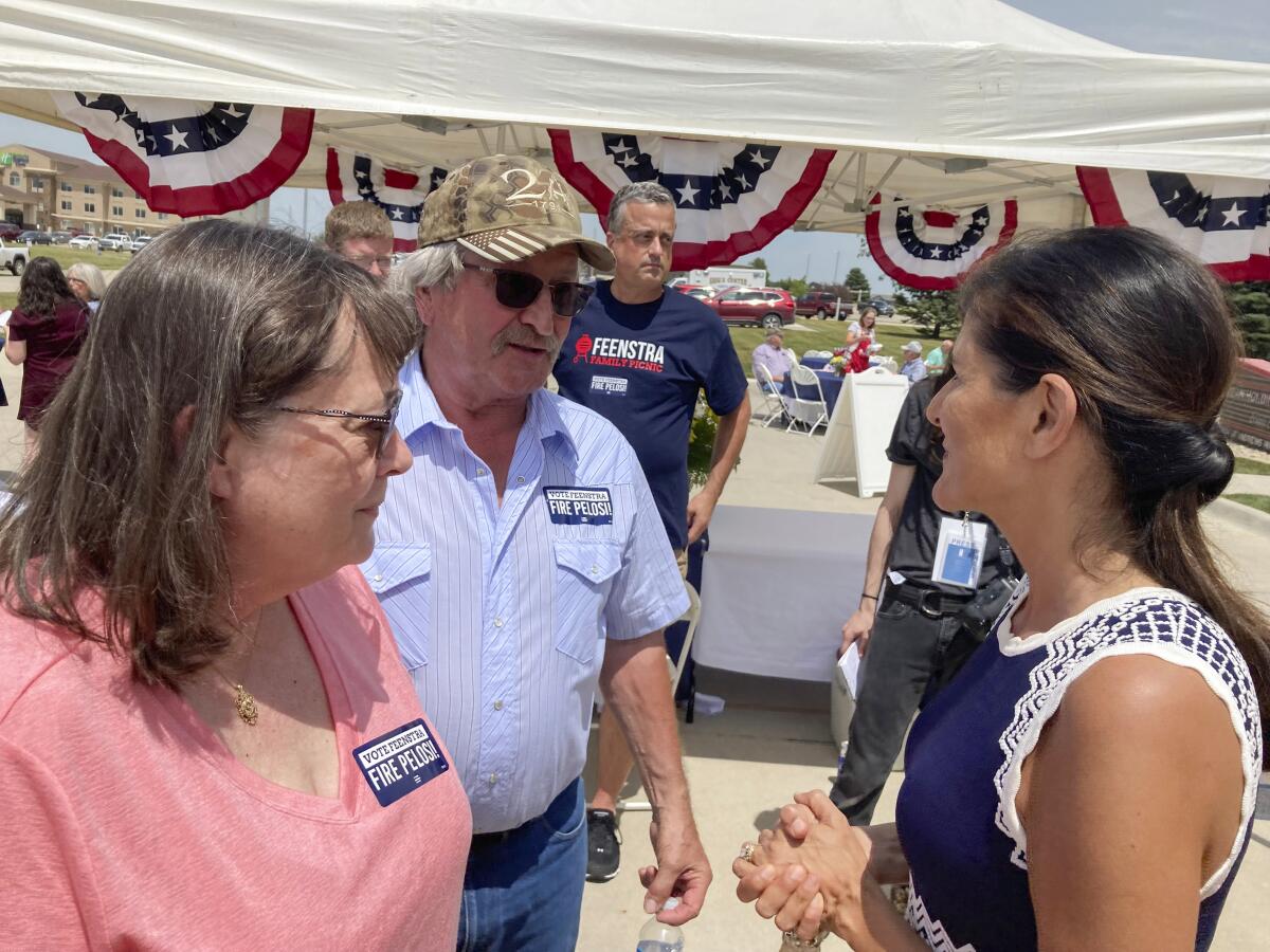 Former United Nations Ambassador Nikki Haley talks with a couple from Iowa.