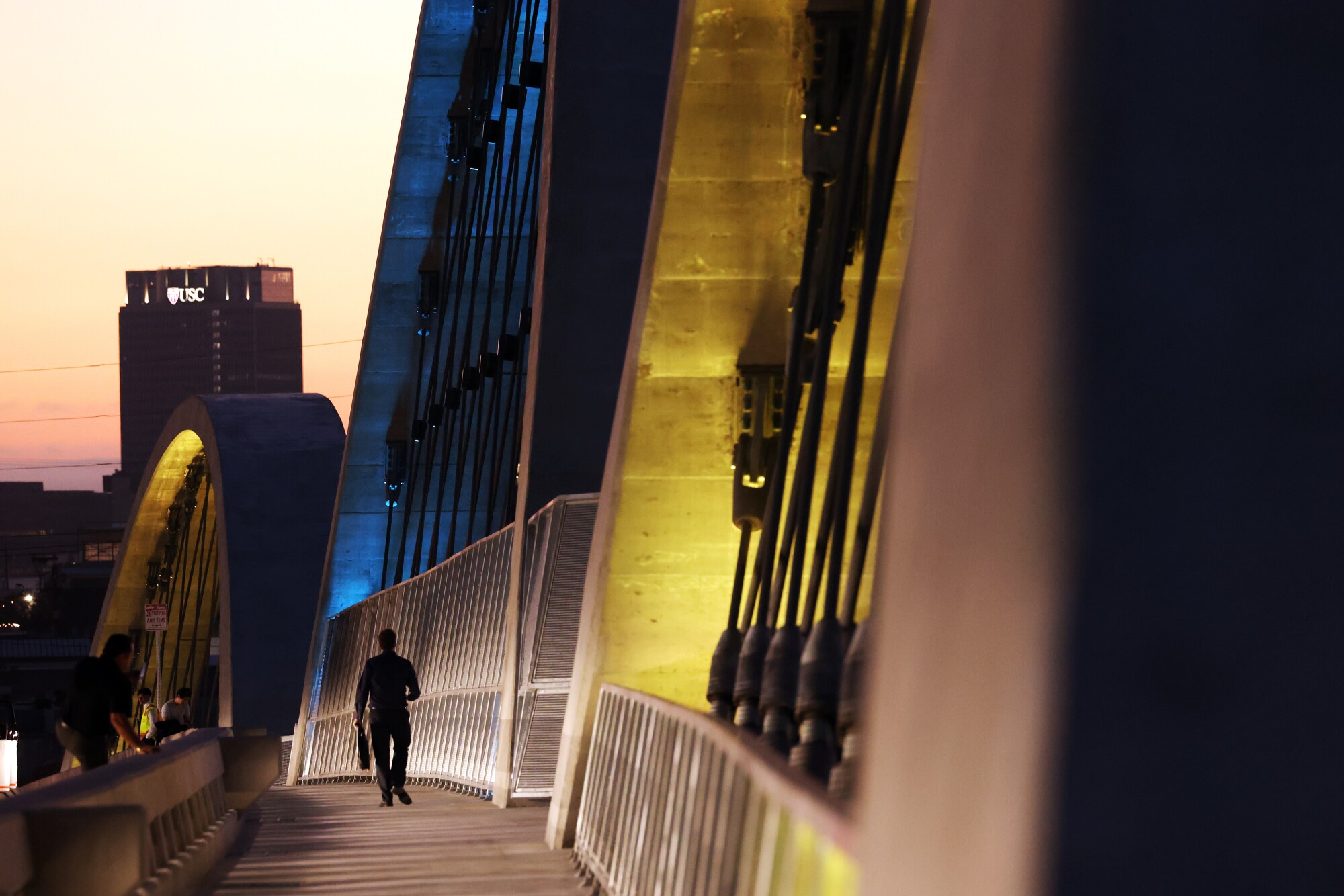 A person walks on the new bridge.