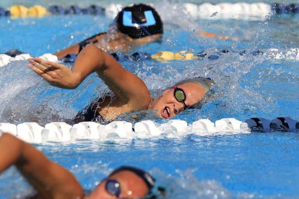 Corona del Mar High's Eliza Britt competes in the girls' 200-yard freestyle during a Pacific Coast League swim meet against University in Irvine on Tuesday.