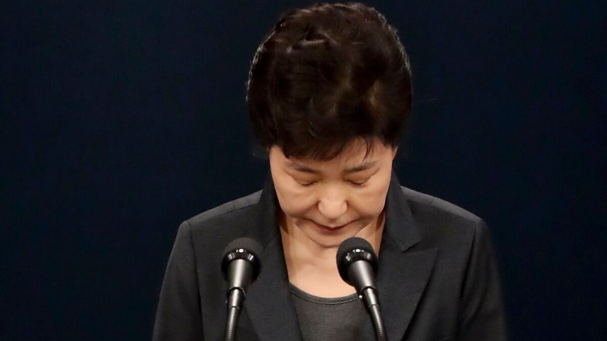 Park Geun-hye bows in apology as she delivers an address to the nation from Seoul on Nov. 4, 2016, when she was still president.