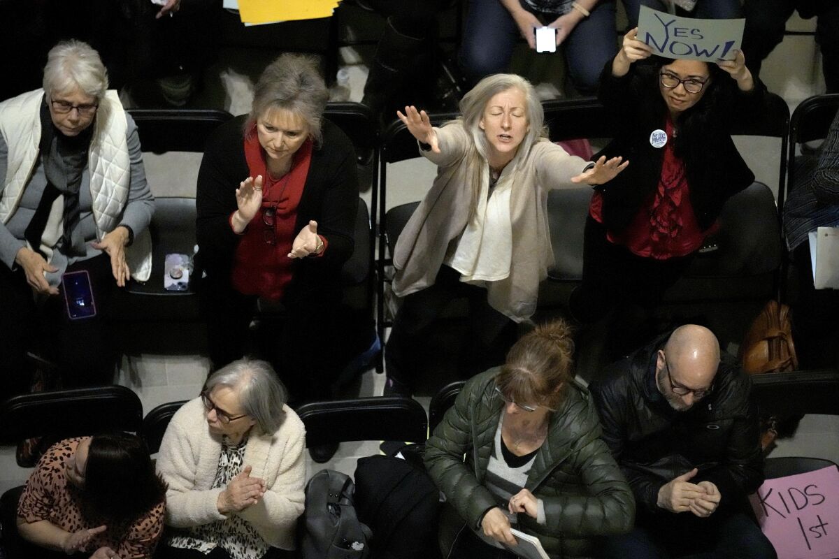 People applaud during a rally in favor of legislation banning gender-affirming healthcare for minors, Monday, March 20, 2023, at the Missouri Statehouse in Jefferson City, Mo. (AP Photo/Charlie Riedel)