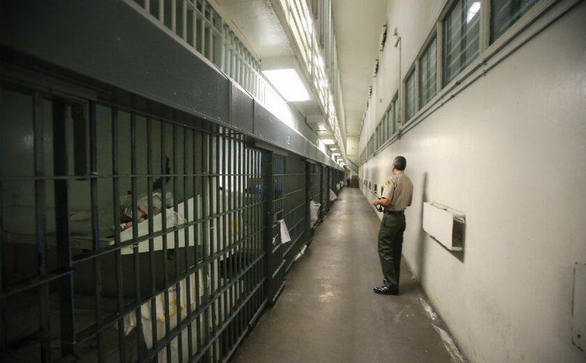 A Los Angeles County Sheriff's deputy looks over a cell module at Men's Central Jail in downtown L.A.