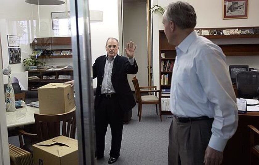 O'Shea speaks to Times Publisher David D. Hiller as he packs up his office.