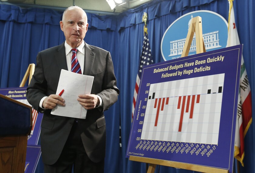 Gov. Jerry Brown leaves a news conference where he unveiled his proposed 2016-17 state budget.