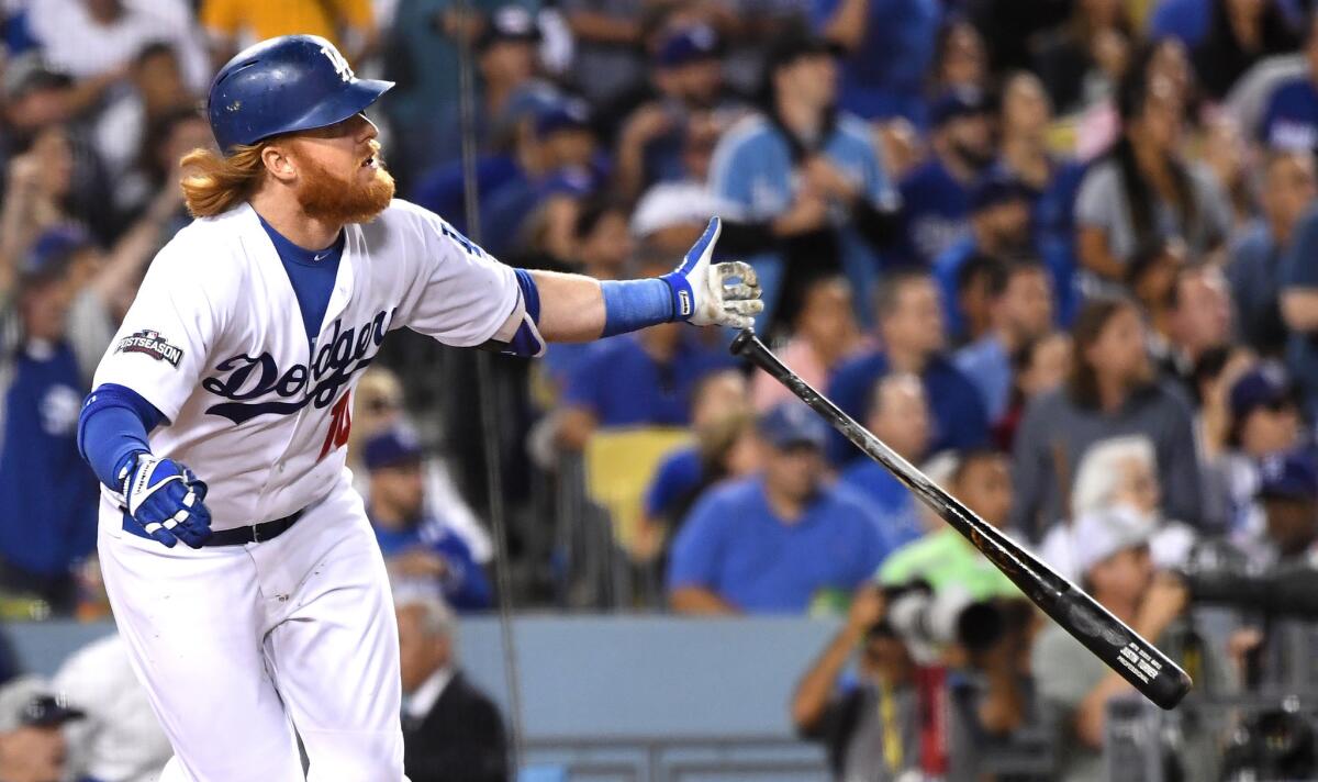 Justin Turner hits a home run during Game 3 of the NLCS.