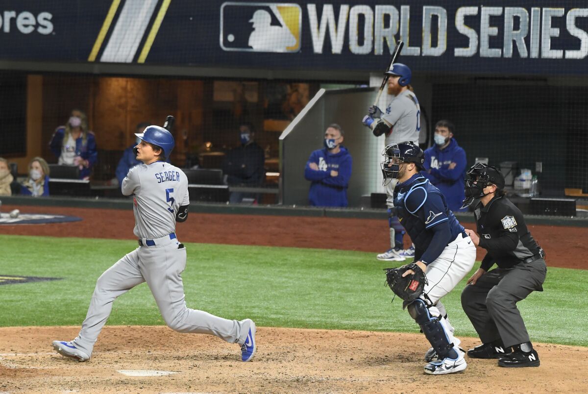 The Dodgers' Corey Seager hits a go-ahead single with two outs in the eighth inning in Game 4 of the World Series.