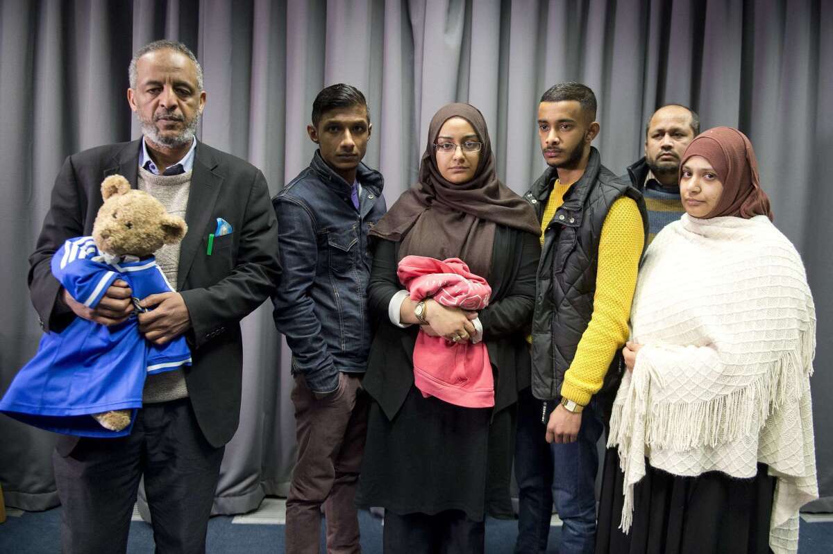 The families of missing British girls Amira Abase and Shamima Begum pose for a picture after being interviewed by the media in central London on Feb.22.