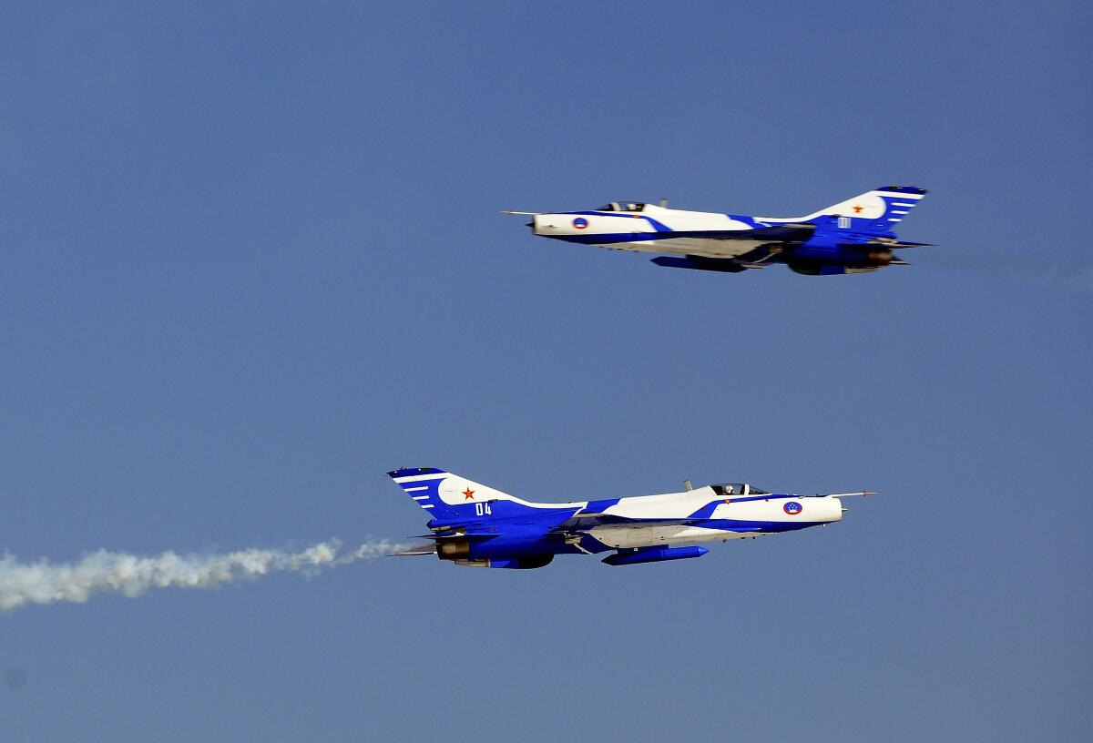 Two Chinese jet fighters in flight