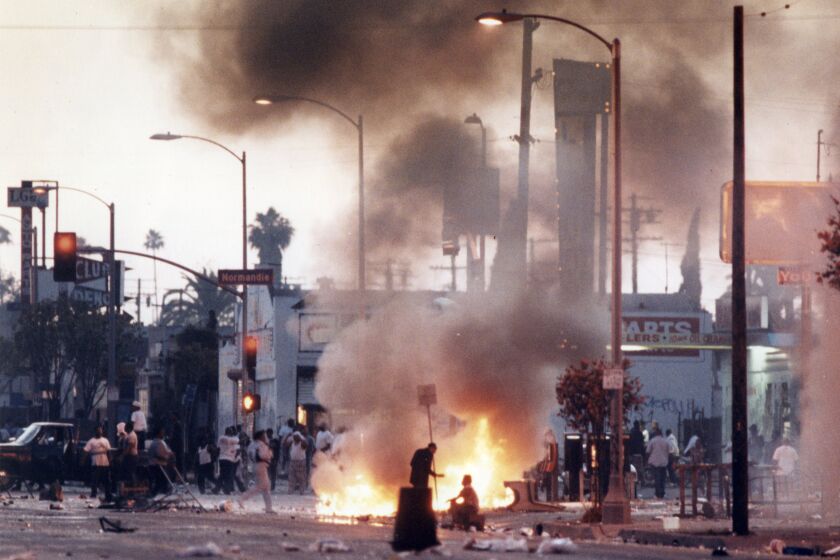 Rioters at the corner of Florence and Normandie avenues the first day of civil unrest 4/29/1992. Kirk McKoy / Los Angeles Times