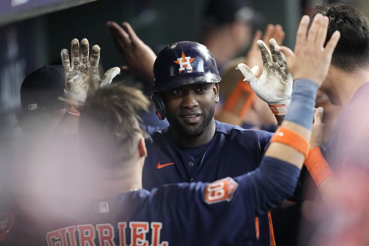 Houston slugger Yordan Álvarez, center, celebrates a home run in Game 2 of the ALDS on Oct. 13, 2022.
