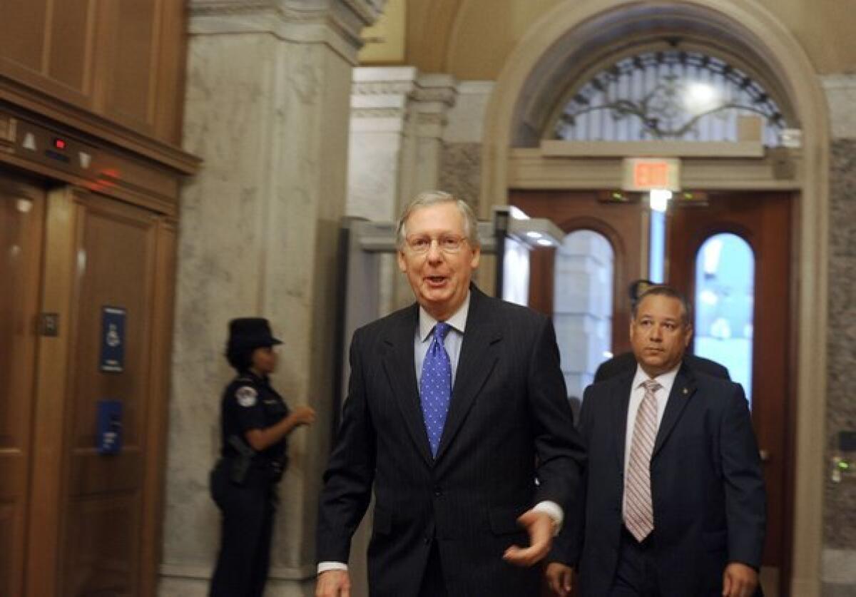 Senate Minority Leader Mitch McConnell (R-Ky.) arrives at Capitol Hill in Washington this week.