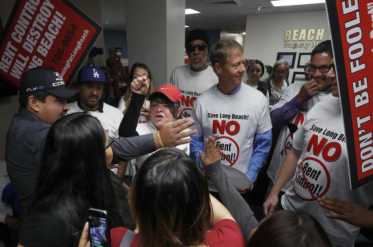Renters facing eviction confront anti-rent-control advocates at the offices of Beachfront Property Management in Long Beach in June