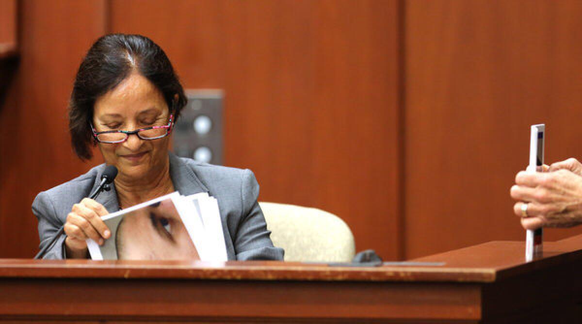 Jacksonville medical examiner Valerie Rao is quizzed by defense attorney Mark O'Mara as she testifies for the state in the George Zimmerman trial in Sanford, Fla. Zimmerman is charged with second-degree murder for the February 2012 shooting death of 17-year-old Trayvon Martin.