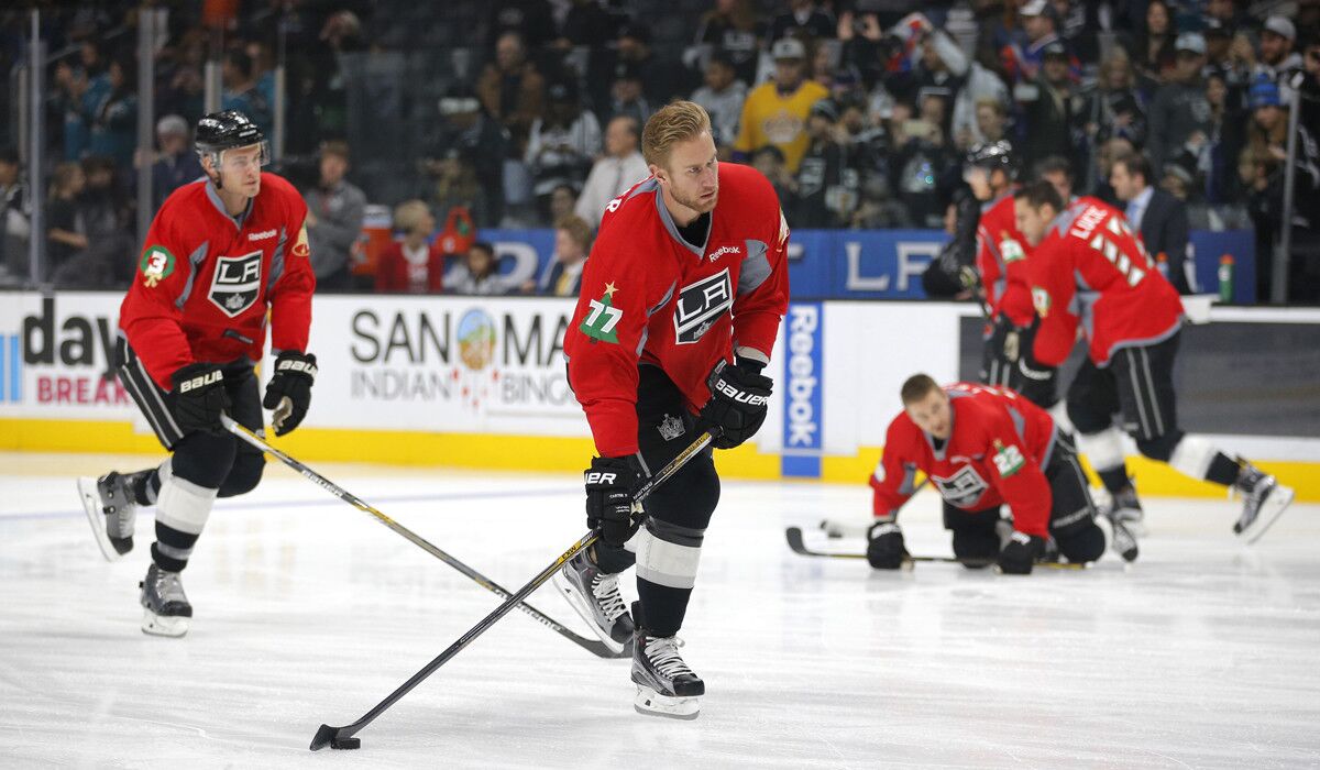 Los Angeles Kings' Jeff Carter, center, skates during warm ups before a game against the San Jose Sharks on Dec. 22.